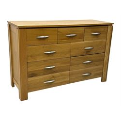 Contemporary light oak sideboard, rectangular top over three short and six long drawers each fitted with chrome handles, on plinth base