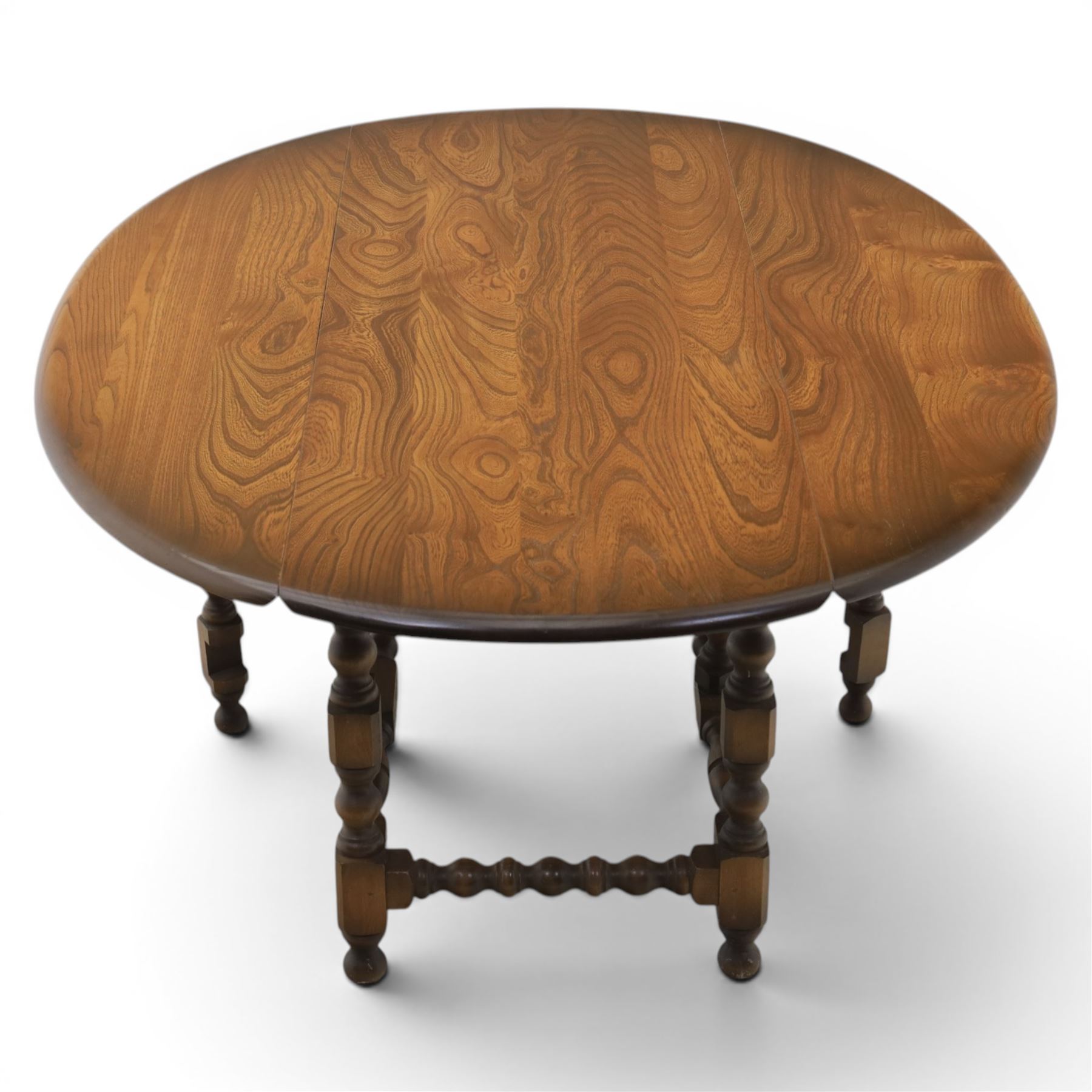 Ercol - elm oval/rectangular drop leaf coffee table, bobbin turned base