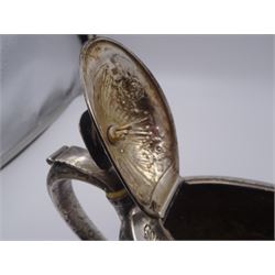 George III silver teapot, of oval form, with embossed foliate, floral and scroll decoration and engraved central cartouche, with acanthus capped C handle with ivory insulators, hallmarked John Emes, London 1807 This item has been registered for sale under Section 10 of the APHA Ivory Act
