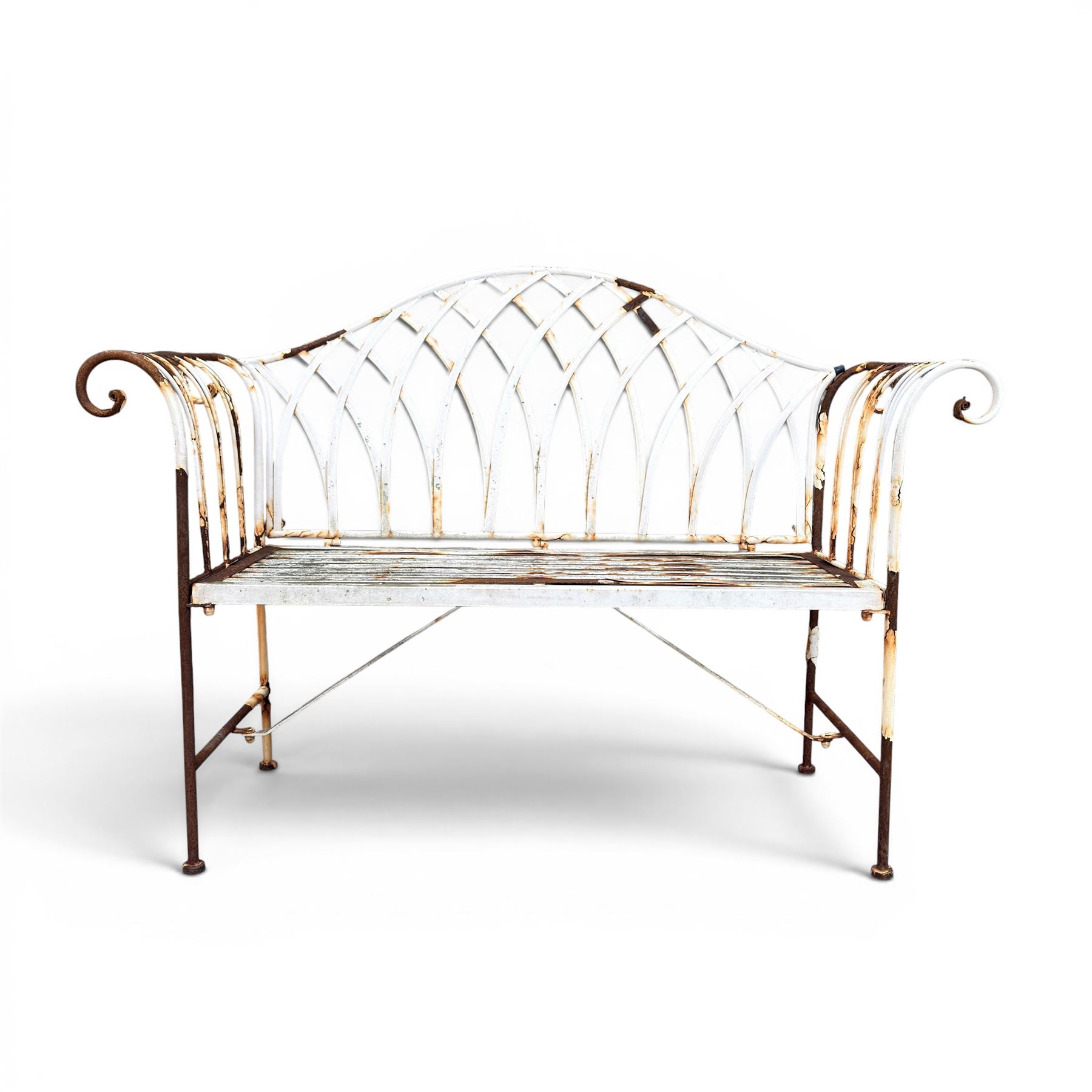 Small wrought metal two seat garden bench, finished in distressed white paint