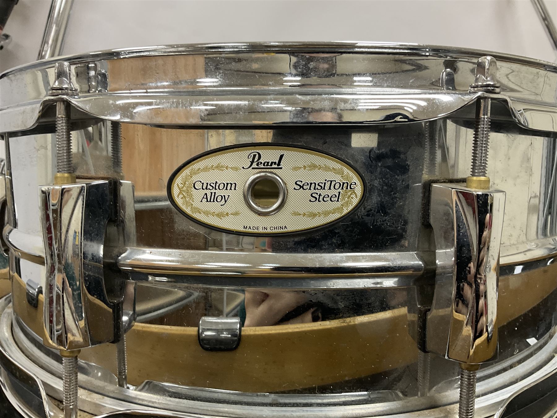 Pearl Vision SST Birch Ply shell four-piece drum kit in black comprising bass drum with foot pedal and three graduated toms; together with Pearl Custom Alloy Sensitone steel snare drum, drum and cymbal stands, microphone stand, stool and various drum sticks 