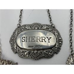 Five modern silver decanter labels, to include three similar Sherry and Brandy examples embossed with scrolls, two hallmarked C Robathan & Son, Birmingham 1989, and one hallmarked Laurence R Watson & Co, Birmingham 1987, together with a scotch example, hallmarked A Marston & Co, Birmingham 1970, and a larger sherry example, embossed with fruiting vines, hallmarked A Marston & Co, Birmingham 1993