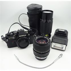 Olympus OM-10 SLR Camera with Olympus neck strap, Olympus OM-System S Zuiko Auto-Zoom 35-70mm 1:4 Lens, Kiron Macro 80-200mm 1:4 Lens in Kiron Protective Case, Ring 282 Twin Flash. 