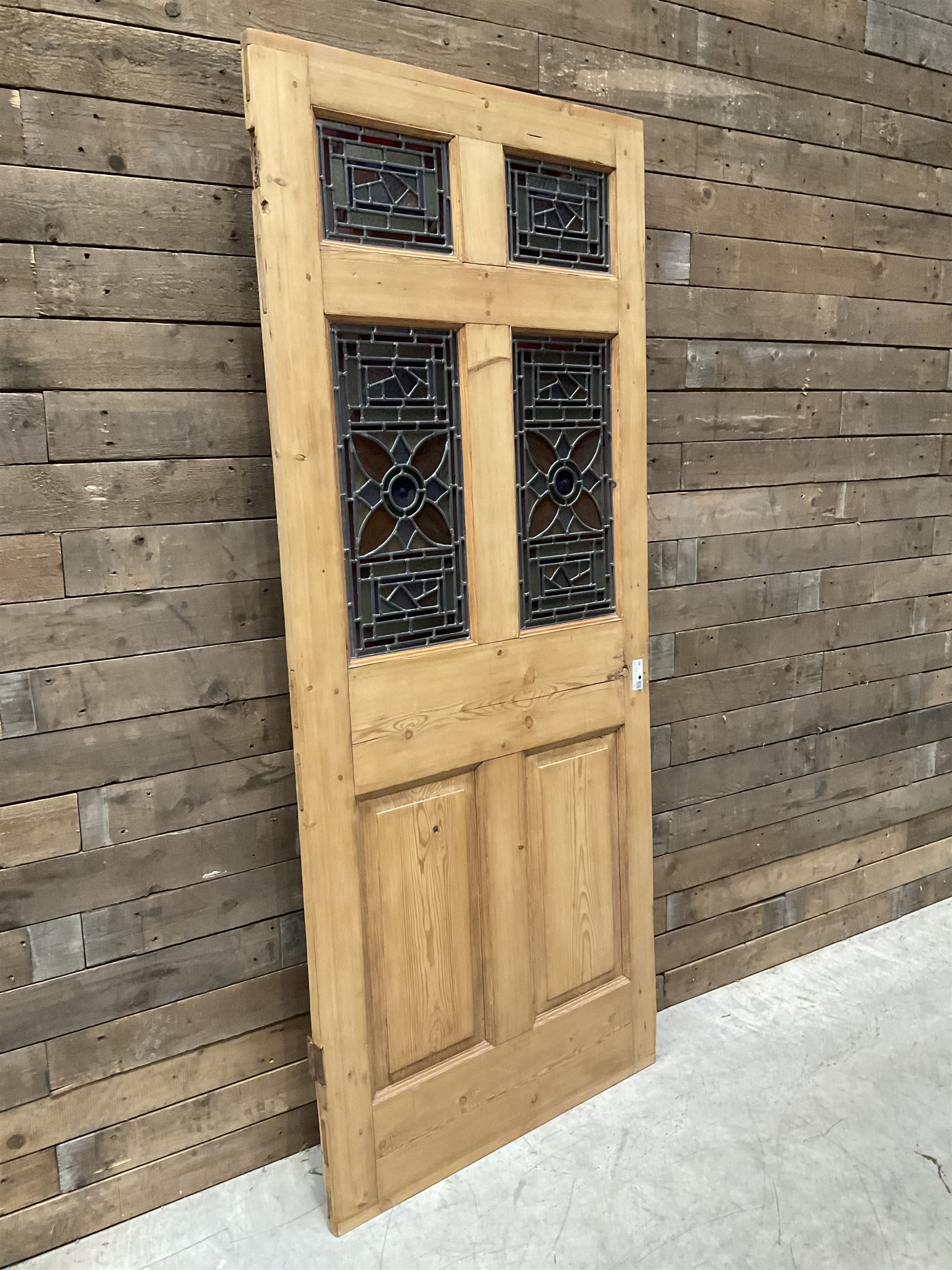 Early 20th century pine six panel door with later stained glass panels