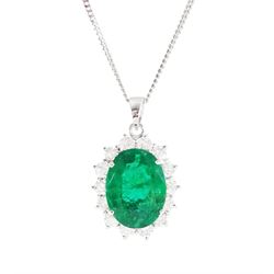18ct white gold emerald and diamond pendant necklace, single oval cut  emerald of approx 3.25 carat, surrounded by fourteen round brilliant cut diamonds, on a fine link chain necklace, hallmarked, total diamond weight approx 0.50 carat