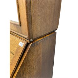 George III oak bookcase on bureau, the double arched top enclosed by two shaped glazed doors, fall-front concealing fitted interior, over four graduating cock-beaded drawers, on bracket feet