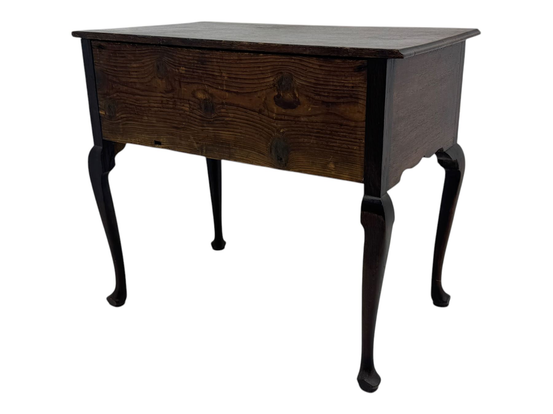 George II oak lowboy, moulded rectangular top over one long and two short drawers fitted with brass drop handles, shaped apron with scrollwork carvings, raised on cabriole supports