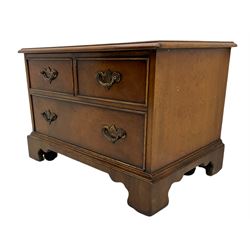 20th century walnut television stand, fall front opening as three faux drawer, enclosing fitted interior, bracket supports