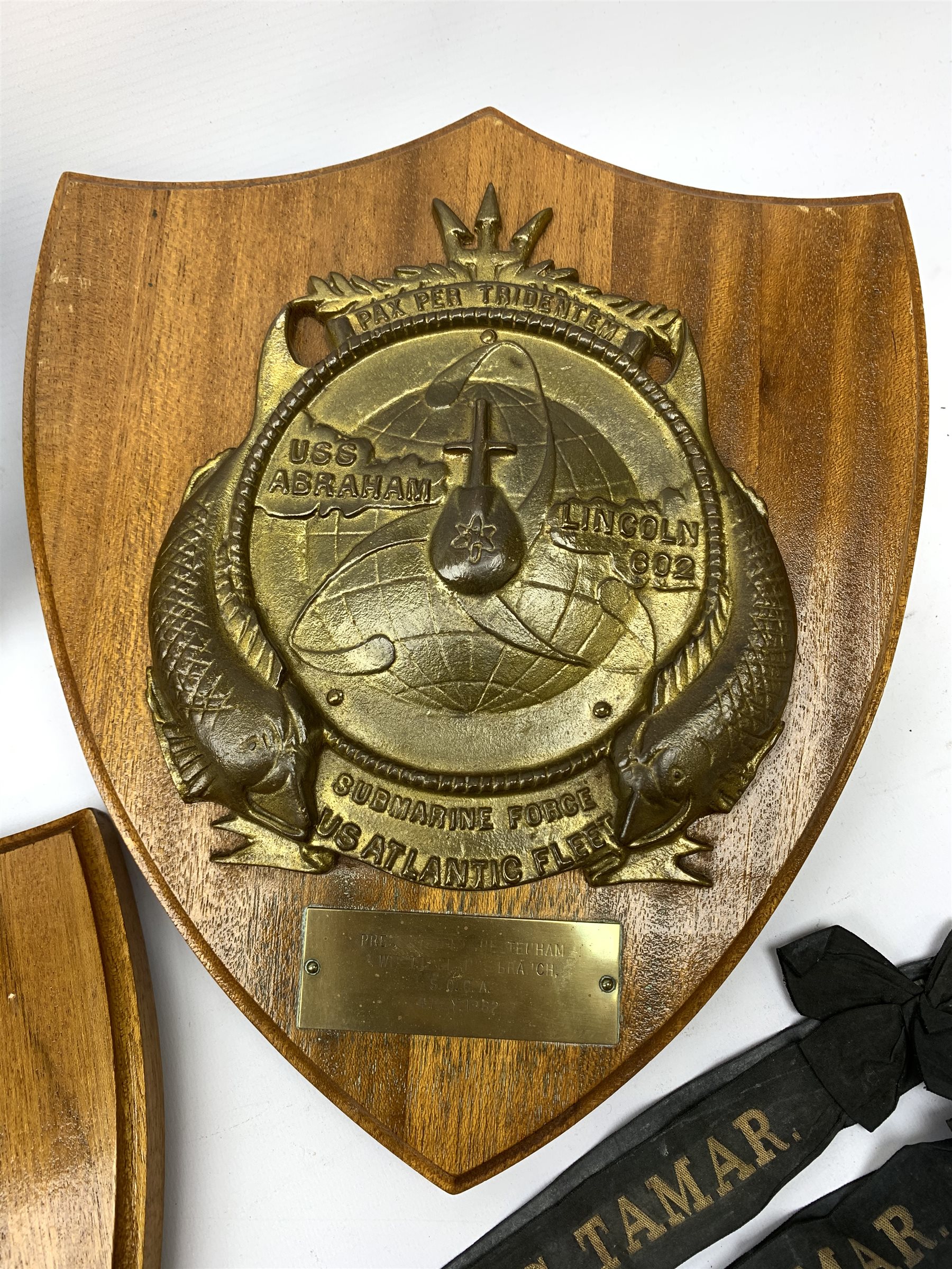  Two Submarine Force US Atlantic Fleet presentation plaques, the first detailed Subron 14, the second USS Abraham Lincoln 602, each H32.5cm, together with five uniform patches, four cap tallies, detailed HSM Tamar (x3), and HMS Ganges, and a set of two limited edition Euro Tunnel commemorative presentation plaques, The Breakthrough 1st December 1990 and Celebration 6th May 1994, D27cm, complete with original certificates.  