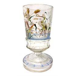 Late 19th century Aesthetic Movement glass vase, the slightly tapering cylindrical clear glass body with faceted lower band, enamelled with a heron and insects amidst blossoming flowers and rushes, upon faceted spreading steam and raised foot with enamelled border, H25.5cm