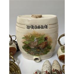 Ceramic hanging light fittings decorated with fox hunting scenes with brass fixtures, ceramic beer pulls decorated with hunting scenes and ceramic whisky barrel decorated with a pheasant