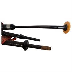 Set of mid 20th century bagpipes, with McLeod chanter, Royal Stuart cover, tassels, ribbons and spare accessories, contained within a wooden carry case, together with a Scarborough Highland Pipe Band uniform, comprising black highland dress jacket, Royal Stuart kilt, Glen Garry hat, Swinging Six sporren, Sgian Dubh knife, piper's dirk with knife and fork, etc