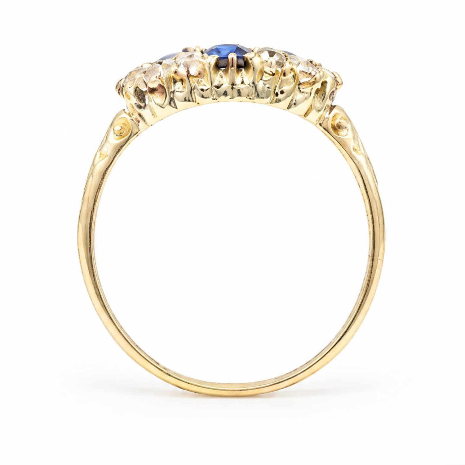 Victorian sapphire and diamond cluster ring, four oval cut sapphires, surrounded by eight old cut diamonds, with scroll design shoulders