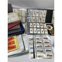 Quantity of cigarette and trade cards including John Player & Sons, Gallaher Ltd, W.A. & A.C. Churchman, housed in ring binder folders and loose together with a few empty vintage cigarette card albums, in two boxes