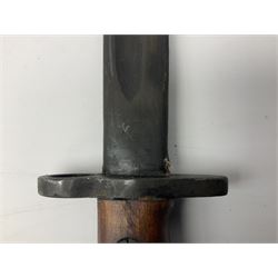 Australian Owen sub-machine gun bayonet, the 25.5cm fullered steel blade marked '53'; in metal bound wooden scabbard marled MA53 L41cm overall