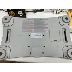 Nintendo Wii console, four controllers with cases and four nunchucks, Wii sensor bar, balance board and dance mat. Guitar hero wireless guitar for Wii and Redoctane wired guitar. Nintendo DS lite handheld gaming console, console and game cases and Guitar Hero Redoctane Guitar Grip. Selection of Nintendo Wii and Nintendo DS lite games to include Super Mario Galaxy, Guitar Hero, Wii Fit, Legend of Zelda games etc. Archos AV400 Series pocket video recorder with accessories, cradle and remote, in three boxes