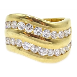  18ct gold diamond double channel ring, wave design stamped 750  