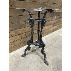 19th century cast iron table base, trefoil column with paw feet