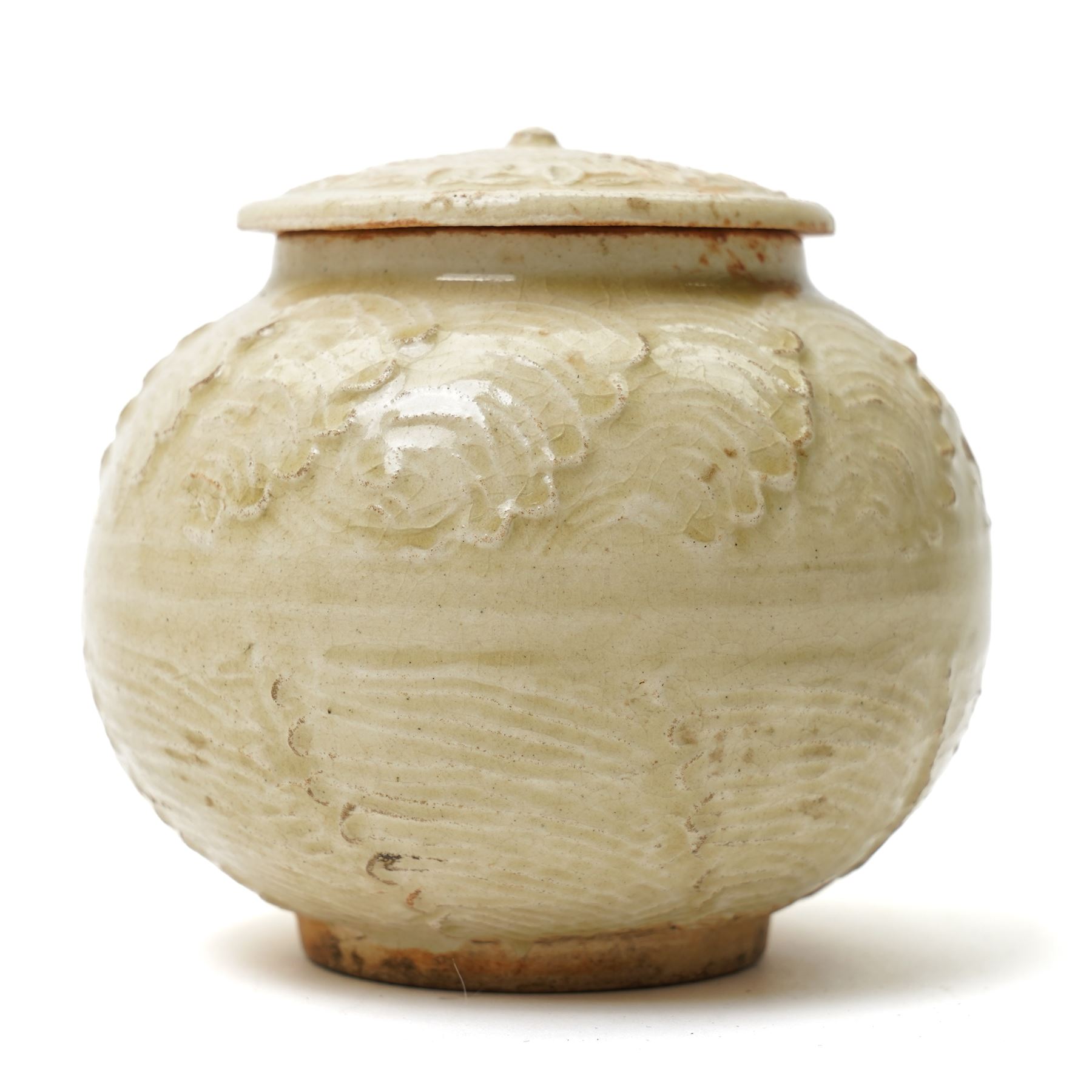 Chinese celadon glazed jar, possibly Ming dynasty, with moulded repeating decoration, 9.5cm