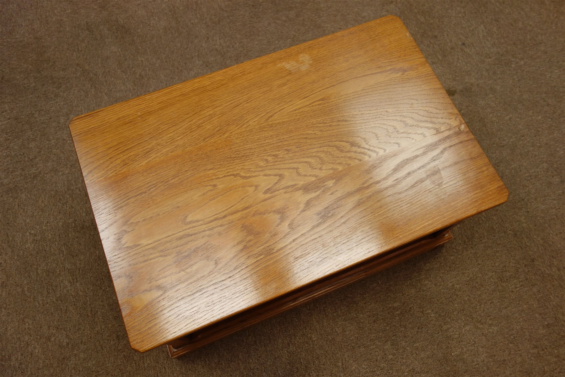 'Seahorse' oak stand/coffee table, panelled sides, plinth base, on castors, by Shaw and Michael