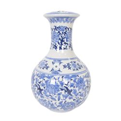 Oriental style blue and white table lamp, with cream shade, H43cm