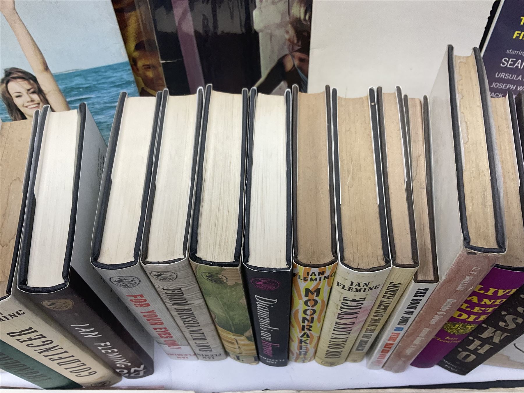 Sixteen James Bond books, including Live and Let Die, The Spy who Loved Me, Four Your Eyes Only, Moonraker etc, together with various 007 ephemera, soundtrack vinyls etc 