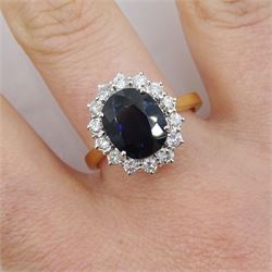 18ct gold oval sapphire and round brilliant cut diamond cluster ring, hallmarked, sapphire approx 2.85 carat, total diamond weight approx 0.90 carat