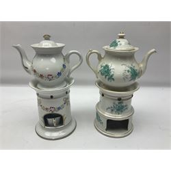 Two 19th century continental teapots and warmers, each teapot upon a cylindrical warming base, hand printed with floral sprigs , largest H26cm