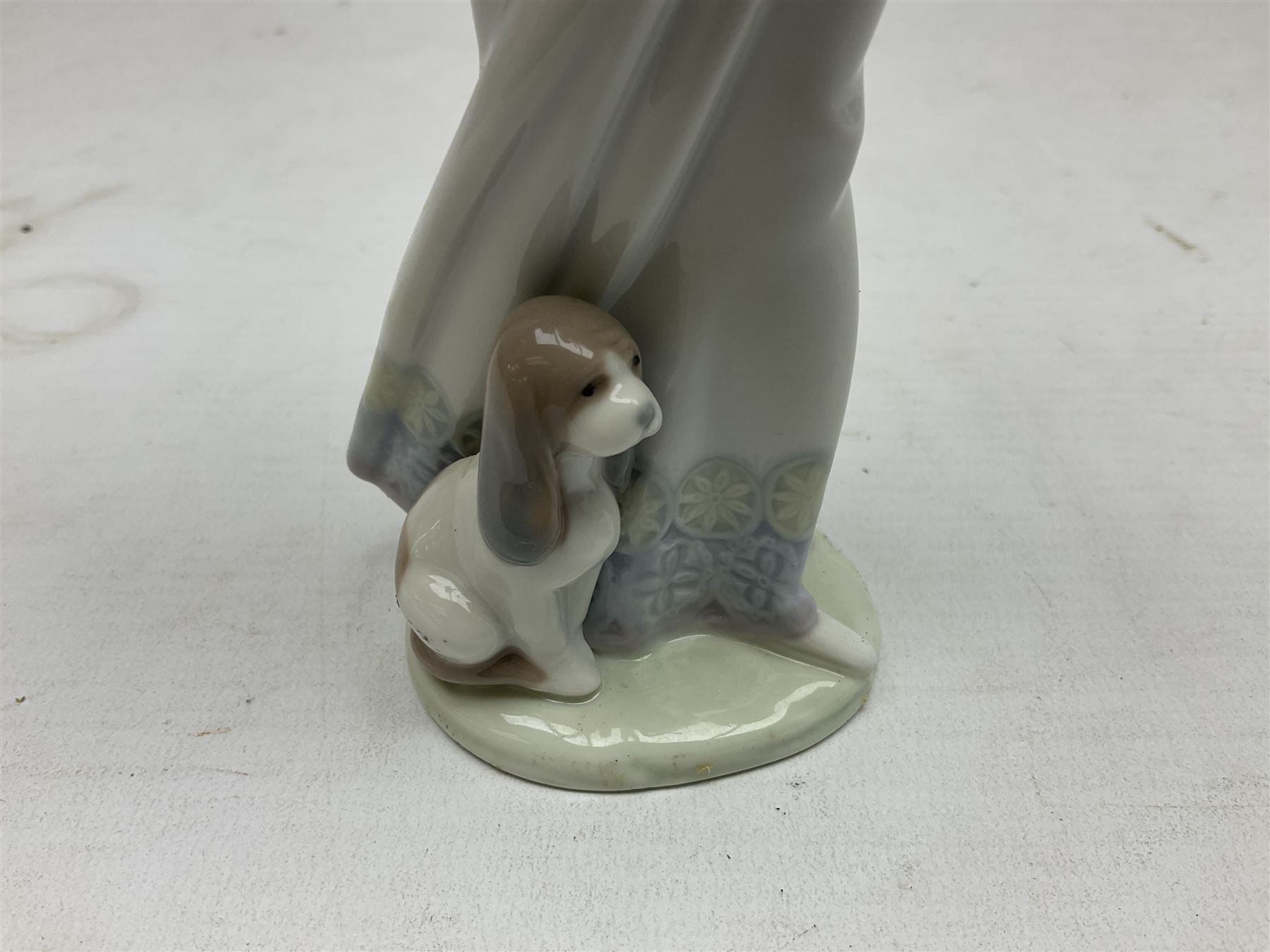 Three Lladro figures, comprising Garden Classic, signed no 7617, Summer Stroll no 7611 and Best Friend no 7620, all with original boxes, largest example H24cm 