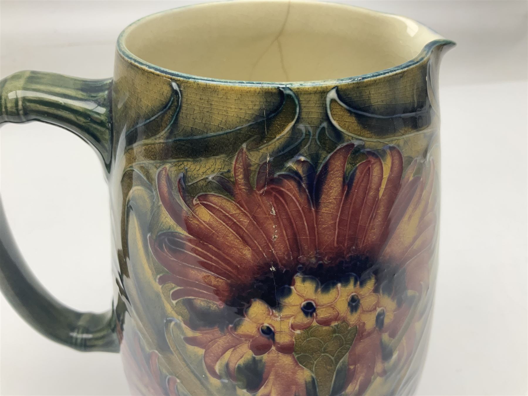 Early 20th century Moorcroft for Macintyre jug, decorated in Revived Cornflower pattern, impressed mark to base, H19cm