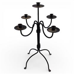 Black metal four branch candelabra, H56.5cm, together with a wrought iron style picket candlestick upon three feet, H45.5cm, and a further four branch example, H39cm