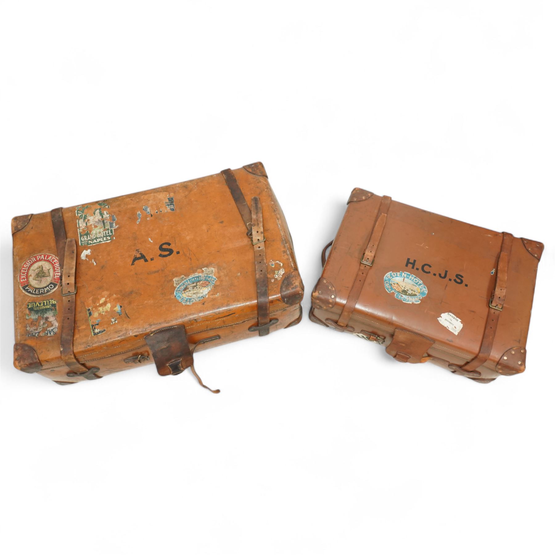 Two late 19th/early 20th century leather travelling 'Ideal' trunks, each stamped and engraved to brass locks F. Best & Co, various travel labels to include the Grand Hotel Naples, Grand Hotel Bellevue, Excelsior Palace Palermo, Waterloo etc, larger suitcase W93cm H32cm D58cm