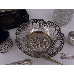 Group of silver, to include continental silver bowl, with figural scene to centre, clothes brush, in fitted case, pair of pepper shakers, open salt, cut glass sugar sifter with silver cover and silver spoons 