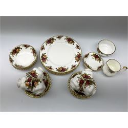 Royal Albert Old Country Roses pattern tea and dinner wares, comprising six dinner plates, five bowls, six side plates, cake plate, butter dish, six teacups and six saucers, open sucrier, and milk jug.