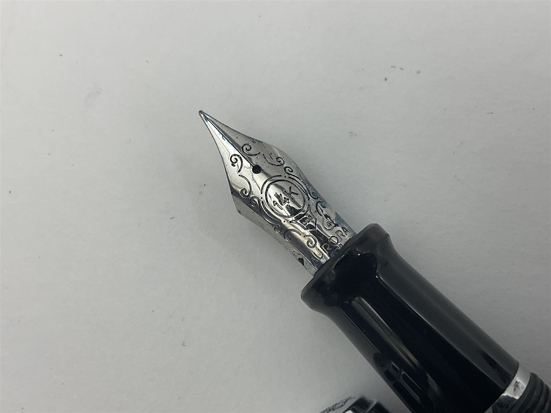 Acqua Di Parma for Aurora fountain pen, the black barrel with chrome mounts and cap, and white gold nib stamped 14K, together with a matching ballpoint pen, L13.5cm (2)