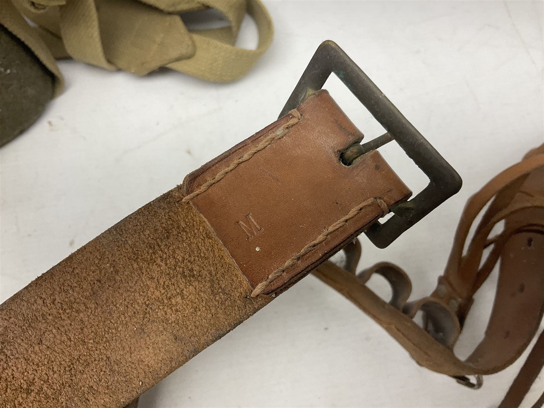 Mundial Brazil bowie knife, the 15.5cm steel blade inscribed 'Sheriff Knife', with banded and aluminium hilt; in leather sheath L29cm overall; British Army felt covered metal water bottle with webbing strap; leather 12-bore cartridge belt; and small pair of non-military binoculars in part case (4)