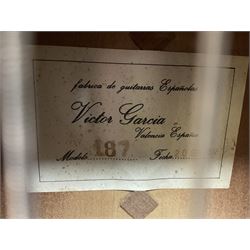 Encore black electric cut-away guitar L96cm; and Spanish Victor Garcia model 187 acoustic guitar, bears label dated 1972 L99cm; each in soft carrying case (2)