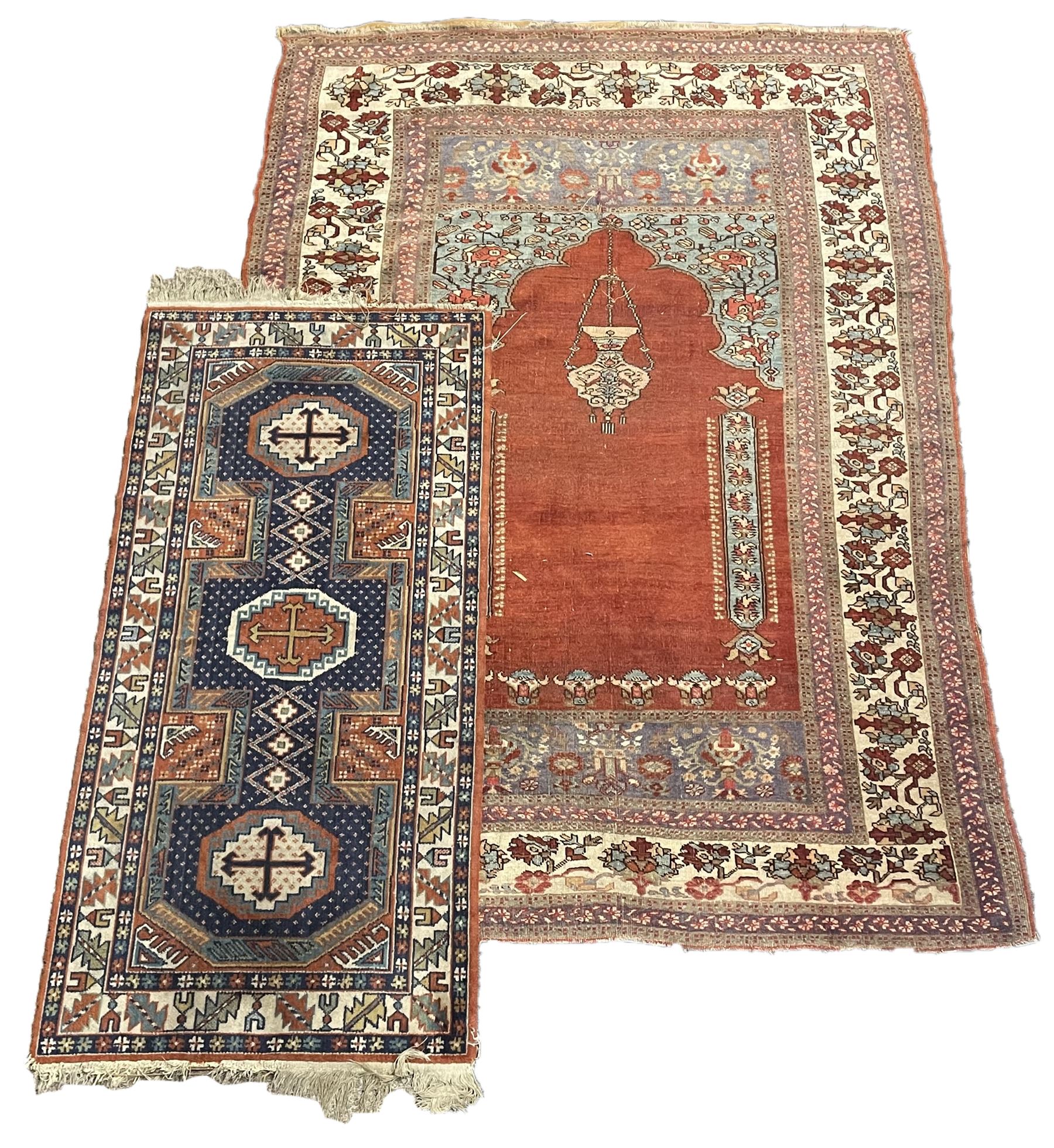 Persian red ground prayer rug, decorated with stylised flowers (201cm x 143cm), and a small Persian design triple medallion rug (142cm x 68cm)