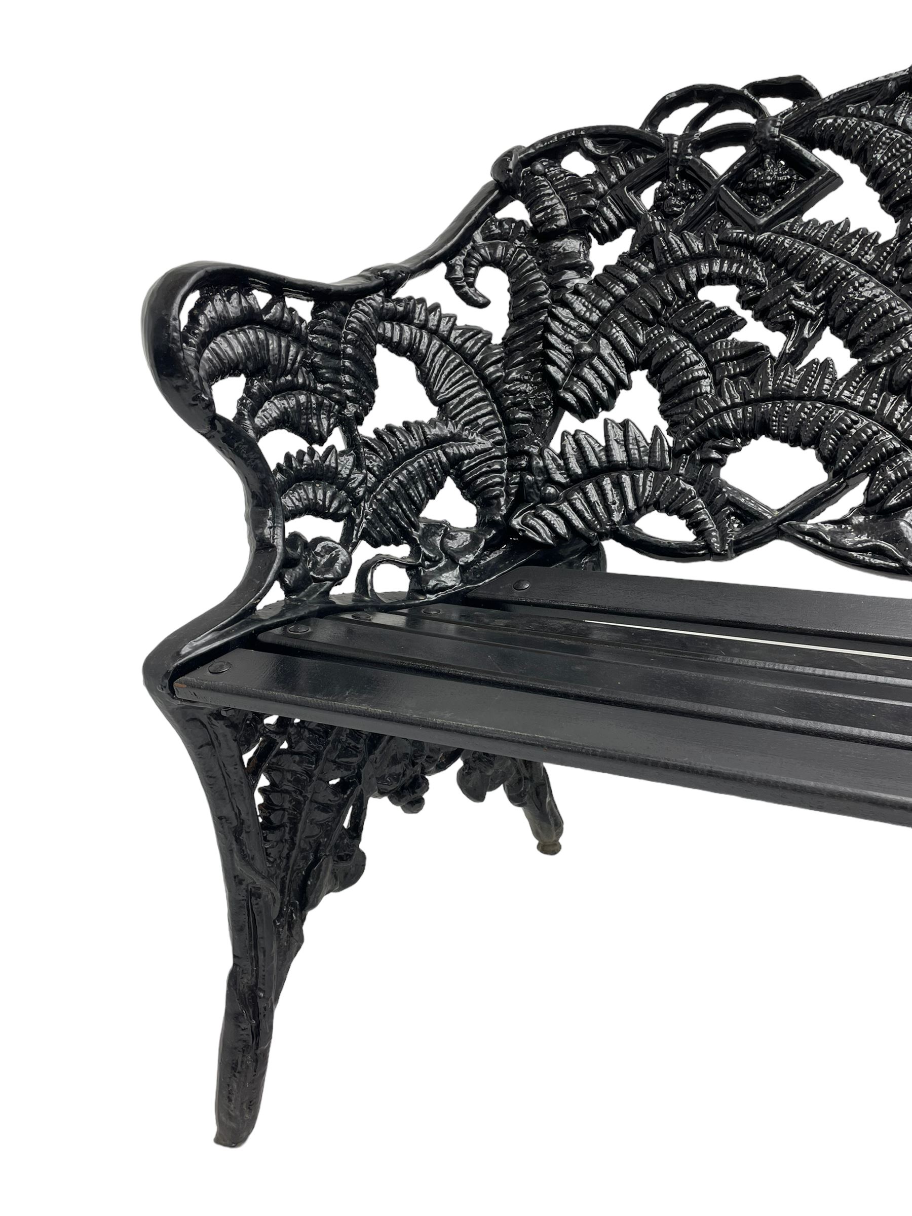 Coalbrookdale - black painted cast iron 'fern' pattern garden bench, decorated with trailing fern leaves, mahogany slatted seat