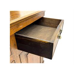 19th century and later oak dresser, moulding cornice a pierced and shaped frieze, over two open plate shelves above a base fitted with two drawers with brass swan neck handles, over panelled twin cupboard with single shelf, cantered corners on bracket feet