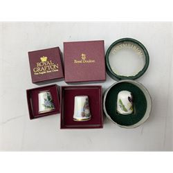 Quantity of thimbles to include twelve Irish Dresden lace examples, Royal Crown Derby, Spode, Portmeirion, Wedgwood, Royal Grafton etc, together with three display cases, many with certificates