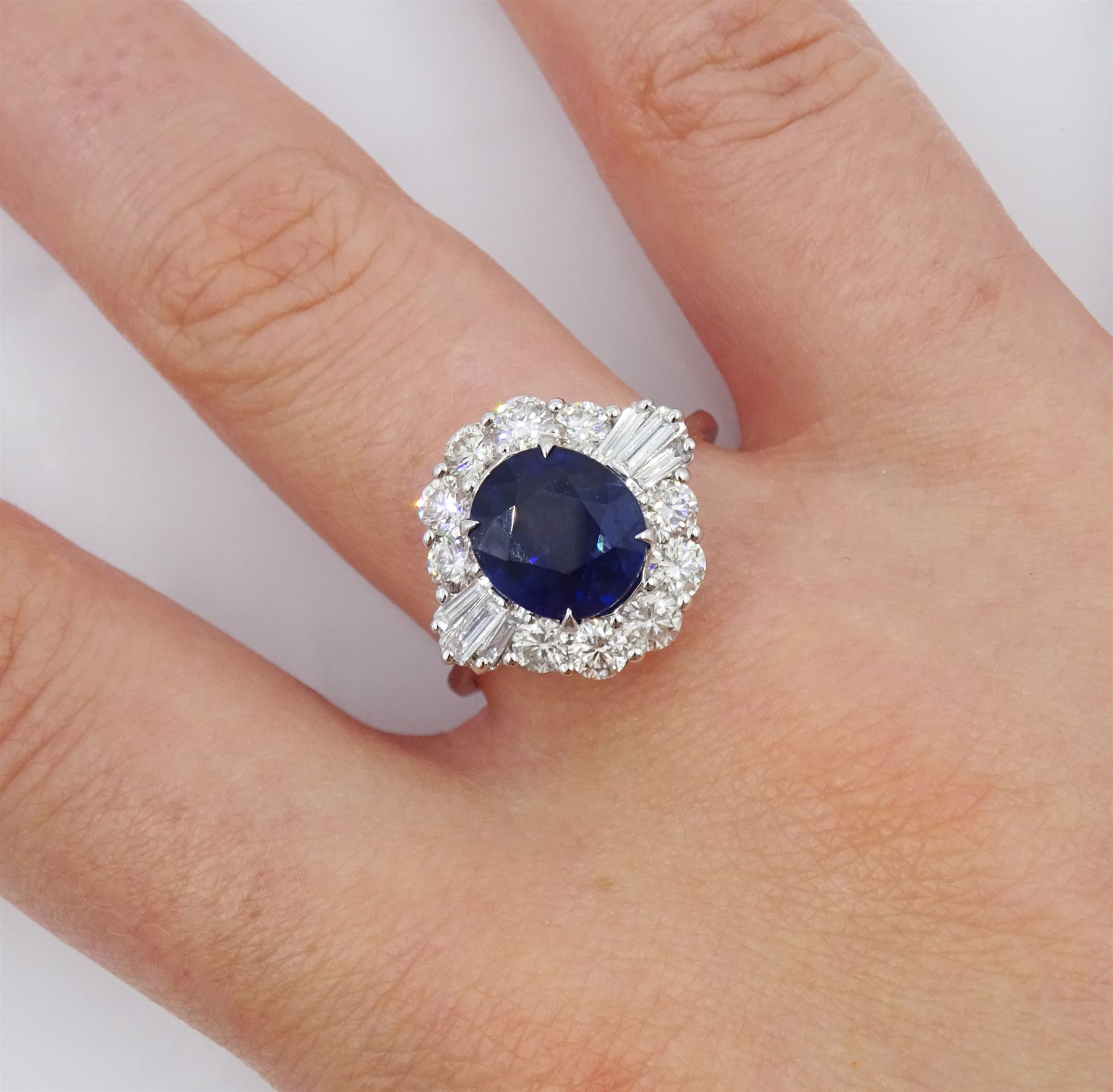 18ct white old oval sapphire, round brilliant cut and baguette cut diamond cluster ring, stamped 750, sapphire 2.93 carat, total diamond weight 1.07 carat, with World Gemological Institute Report