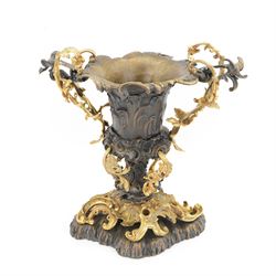After Henry Dasson (1825-1896): large French gilt bronze urn, the body of typical form and cast with C scrolls, with twin curved gilt foliate handles detailed with birds, upon a scrolling foot, and naturalistically cast base, impressed HENRY DASSON to foot, H50.5cm W48cm