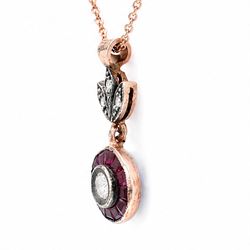 Gold and silver ruby and diamond pendant, single round brilliant cut diamond, surrounded by calibre cut rubies and round brilliant cut diamonds, suspending from a fancy pendant set with further diamonds, on a rose gold plated silver chain necklace, total diamond weight approx 0.30 carat, total ruby weight approx 0.30 carat