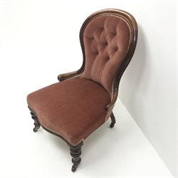  Victorian mahogany framed spoon back nursing chair, upholstered in deep buttoned fabric, turned supports, W57cm  