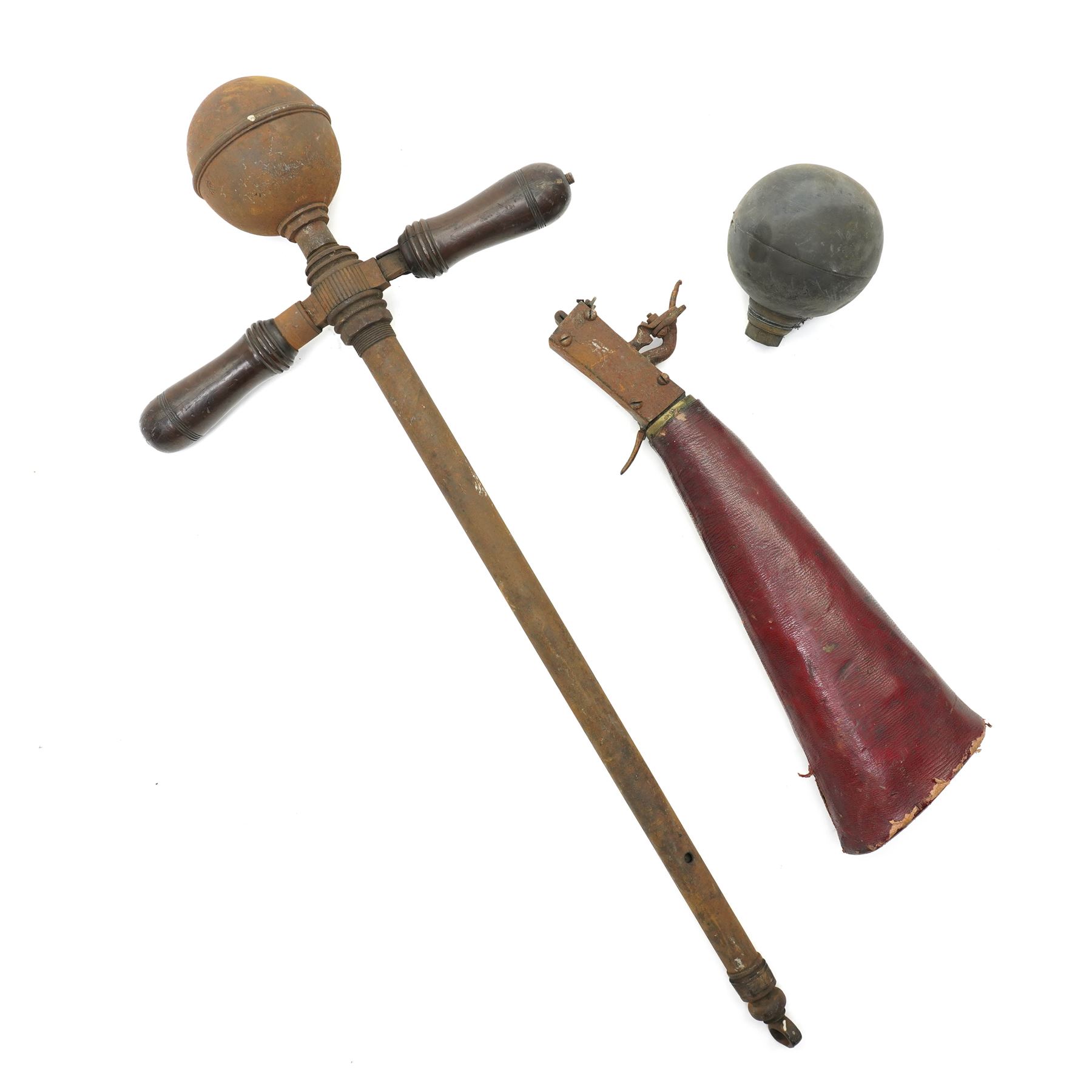 The remains of an 18th century air rifle, possibly German comprising red morocco covered butt and lock, pump with reservoir and spare reservoir 
Provenance: property of a Nobleman