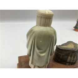 Japanese parquetry puzzle box L12cm; another Japanese puzzle box with marquetry top of Mount Fuji; eleven graduated Chinese figures including immortals; and Chinese figure of a lady standing on a hardwood base next to a horn table (14)