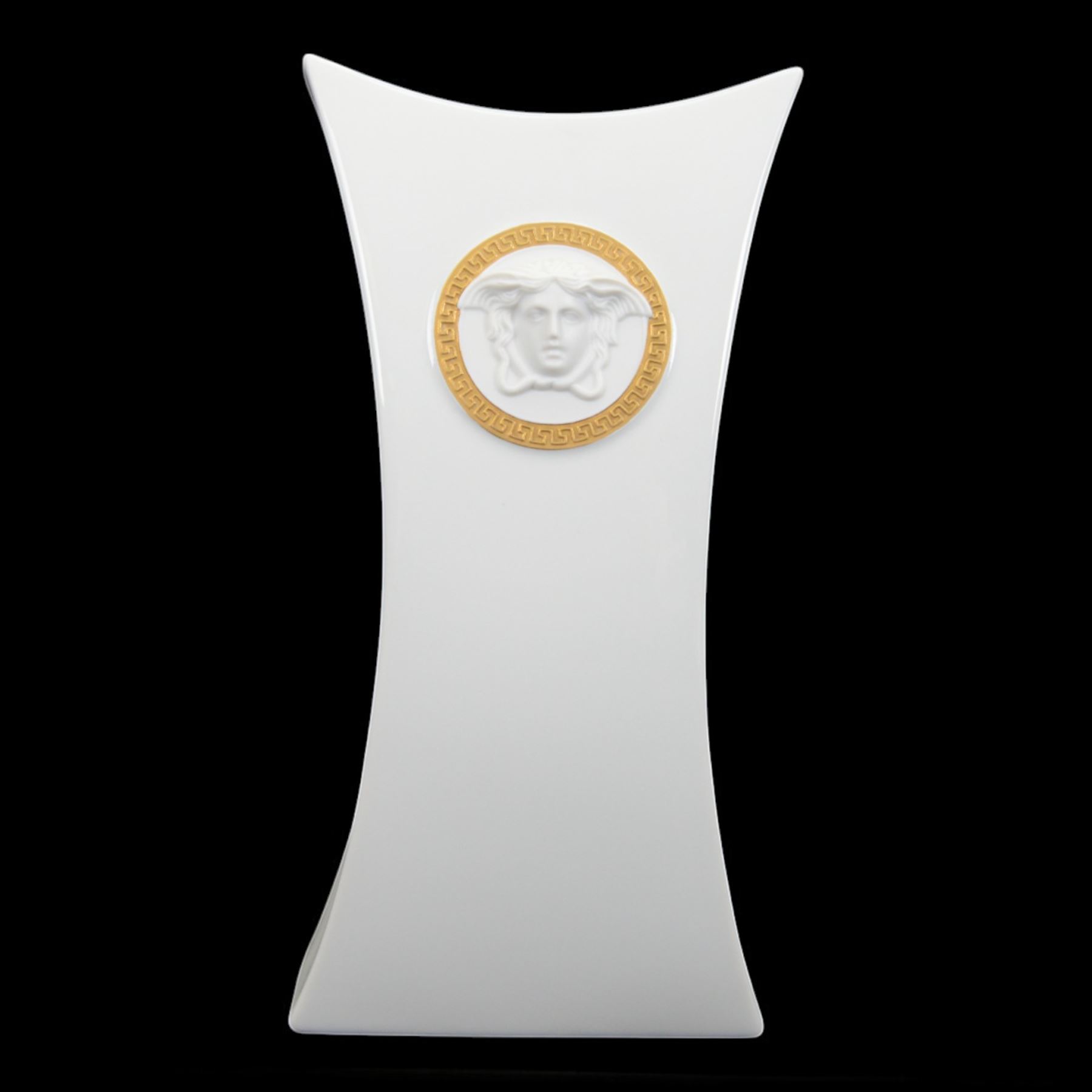 Rosenthal Versace Gorgona vase, of concave form, decorated in relief with medusa masks and gilt greek key borders upon a white ground, boxed, H25cm