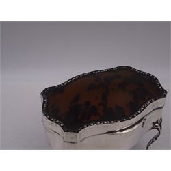 Early 20th century silver mounted jewellery casket, the slightly domed hinged cover set with a tortoiseshell panel, with a embossed floral border, opening to reveal a pleated silk lined interior, upon four cabriole legs, hallmarked Charles Boyton & Son Ltd, London 1913, H10cm