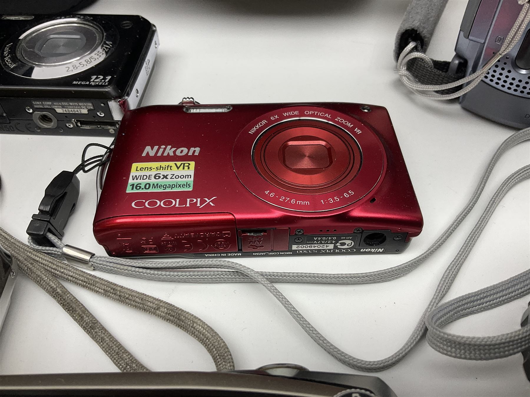 Nikon Coolpix 8700 camera body, serial no 3220838, with Zoom Nikkor Ed 8.9-71.2mm 1:2.8-4.2 lens, together with Canon digital video camcorder and other digital cameras and camera equipment